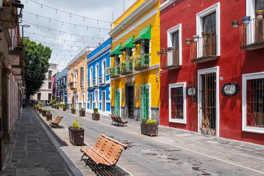 Puebla: Brightly colored houses lining a street in Puebla