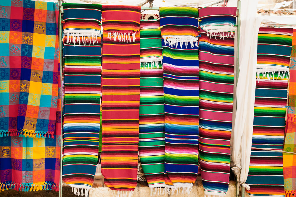 San Cristobal de las Casas: Typical Mexican textiles hanging against a white wall