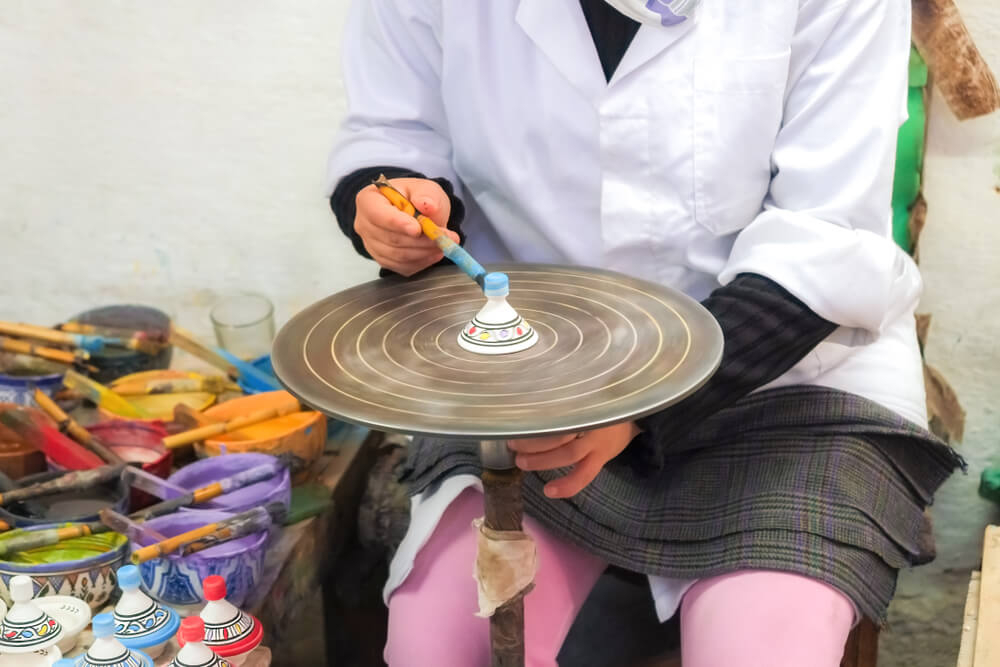 Morocco: A person making traditional Moroccan pottery