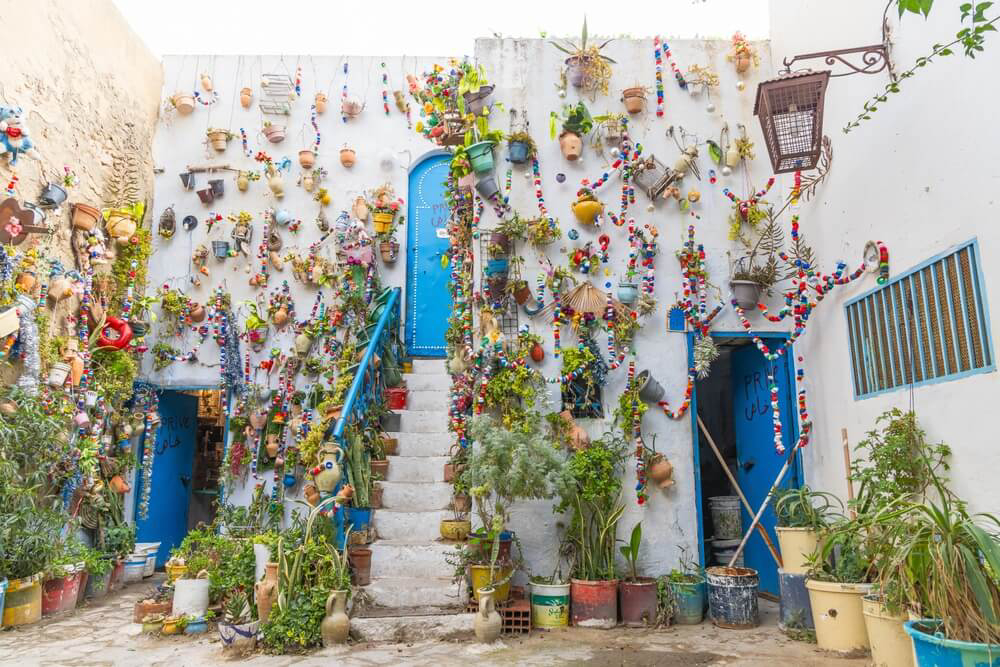 Hammamet, Tunisia: A close up of the whitewashed facades dressed in colourful decorations