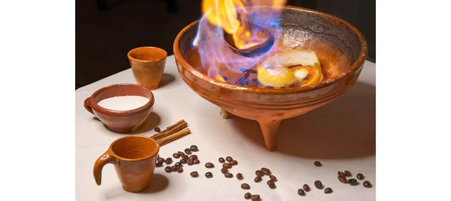 Quemaida Gallega: A ceramic pot with flaming alcohol, lemon and coffee beans