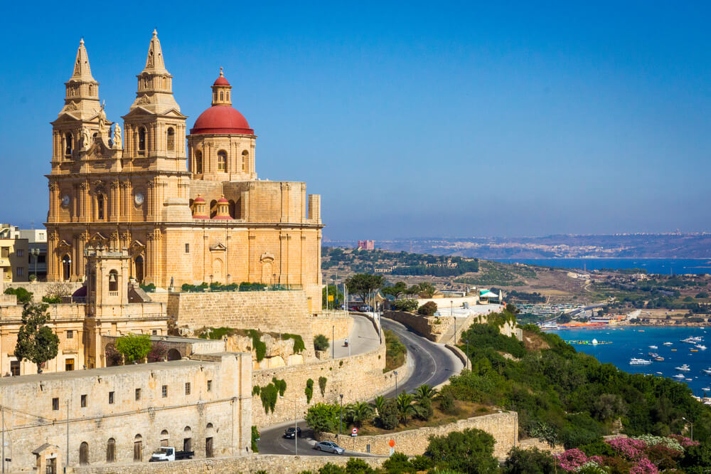 Malta visiting places: The Parish Church of Mellieha viewed from the coastline