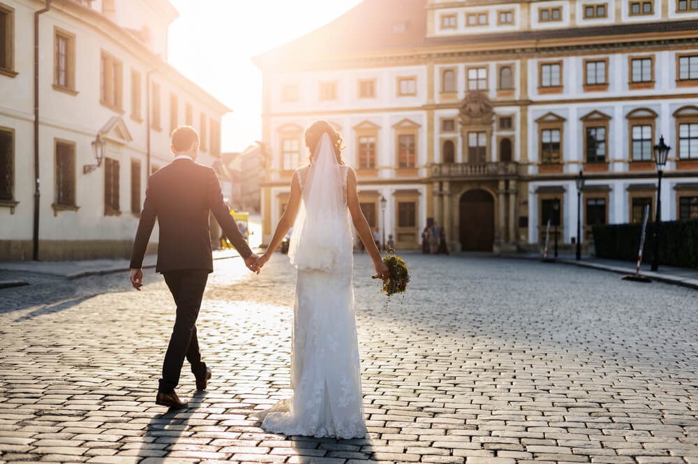 Prague: A newlywed couple walking through Budapest
