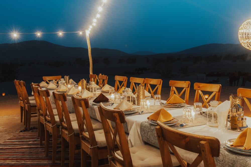 Morocco: A picnic table decorated for a feast in the middle of the desert