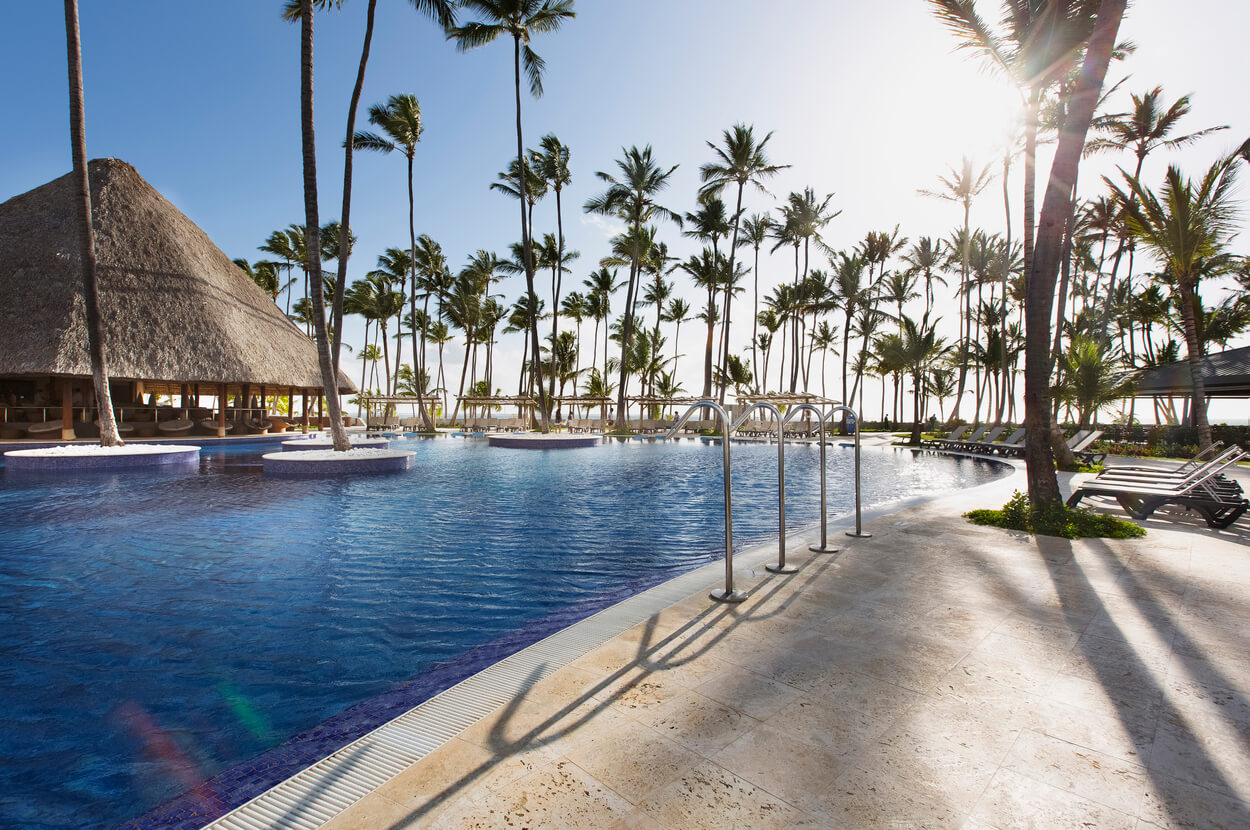 Barceló Bávaro Beach: the hotel pool surrounded by palm trees
