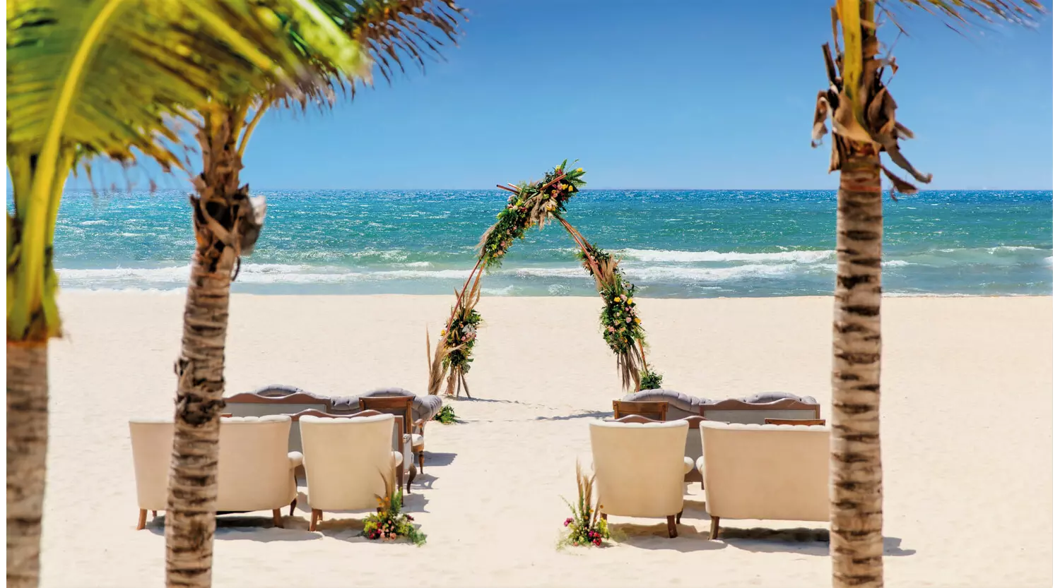 Royal Hideaway Playacar: white sand beach set up for a romantic gathering
