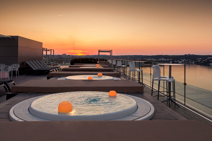 Wellness holidays: the hot tubs at sunset at Barceló Hamilton Menorca
