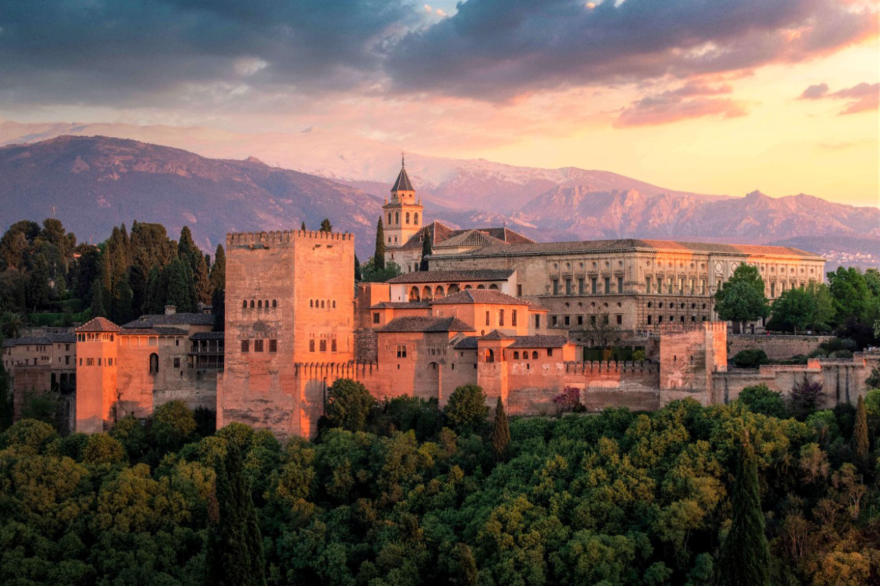 Happy Tourism Day: View of the Alhambra palace in Granada at sunset