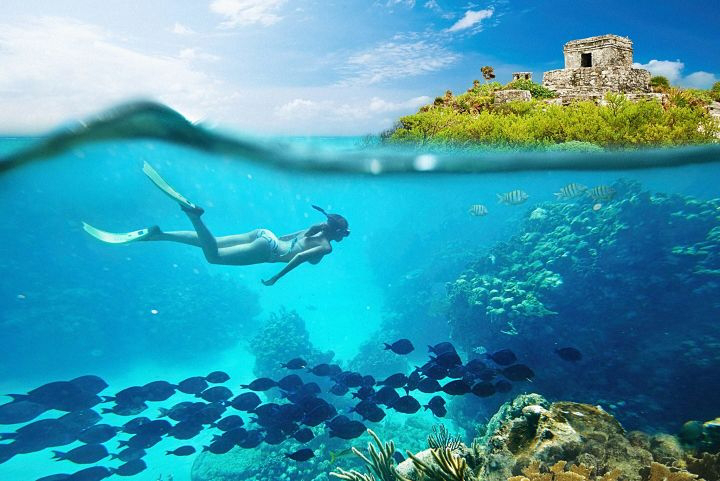 Woman snorkeling in the Riviera Maya Caribbean Sea