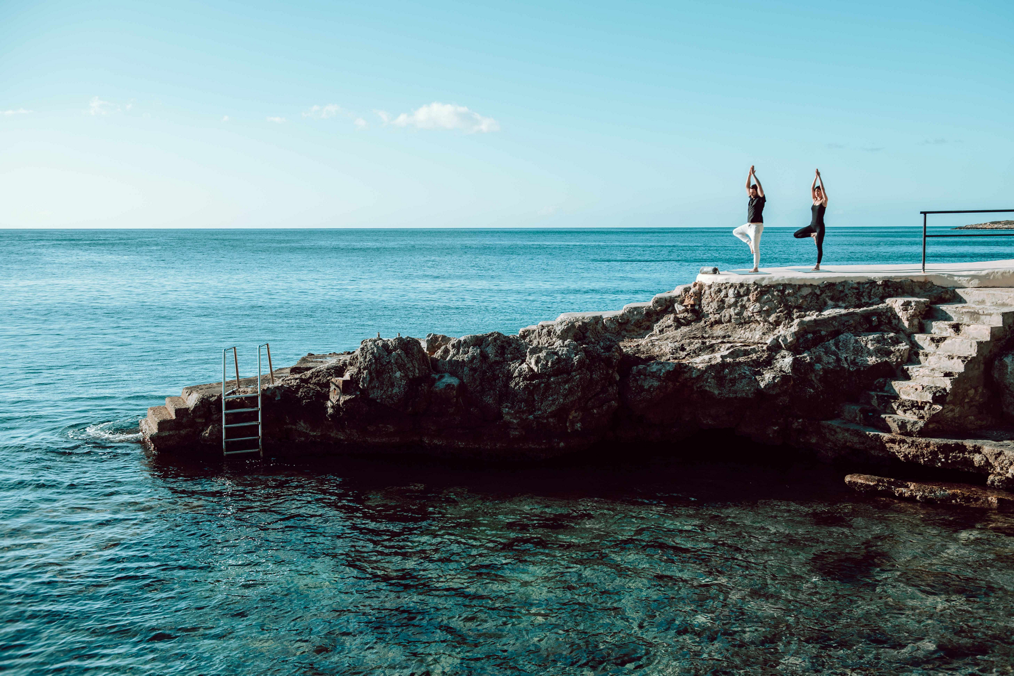 Go on a yoga vacation and do yoga on the seashore.