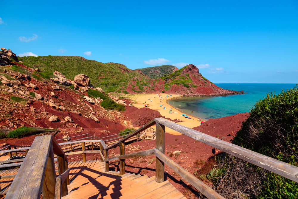 Best beaches in Menorca: Wooden steps heading down to Cala Pilar