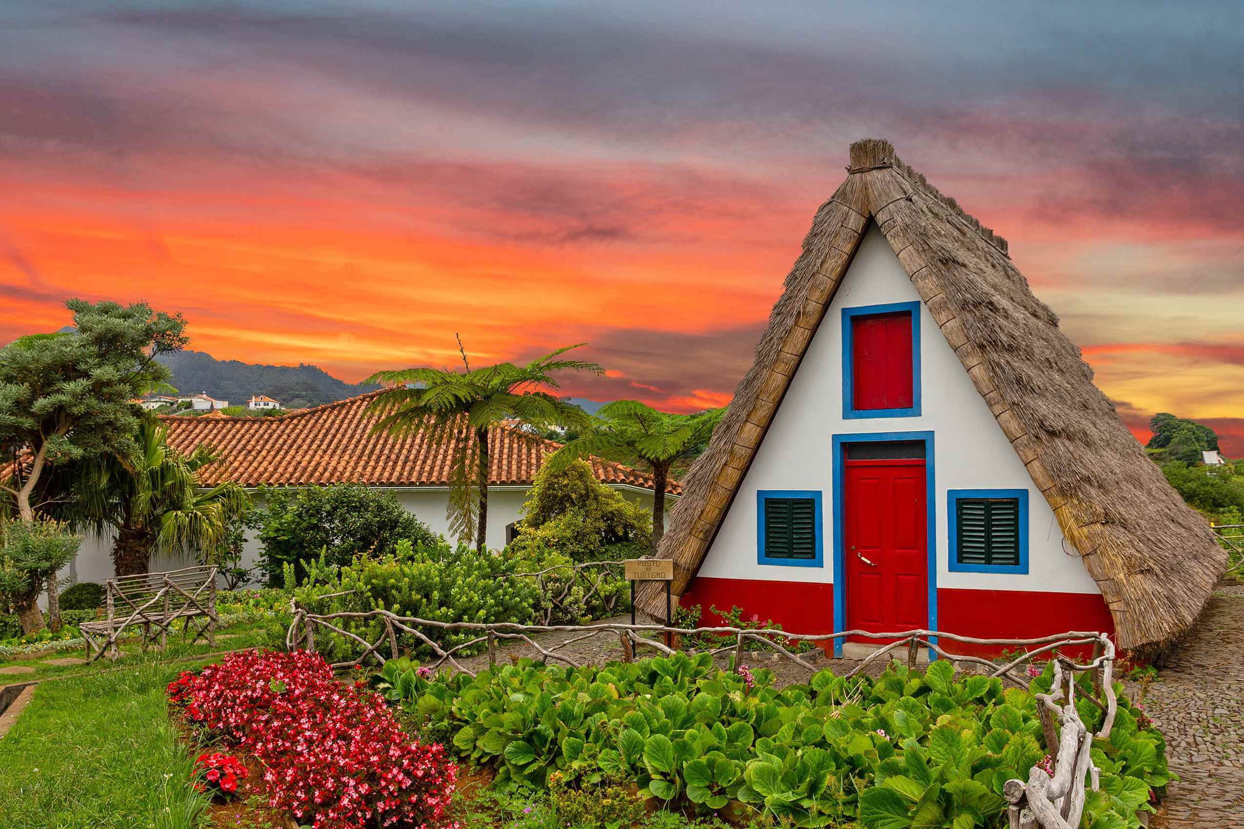 Black Friday Hotel Deals: A thatched roofed cottage in a tropical garden