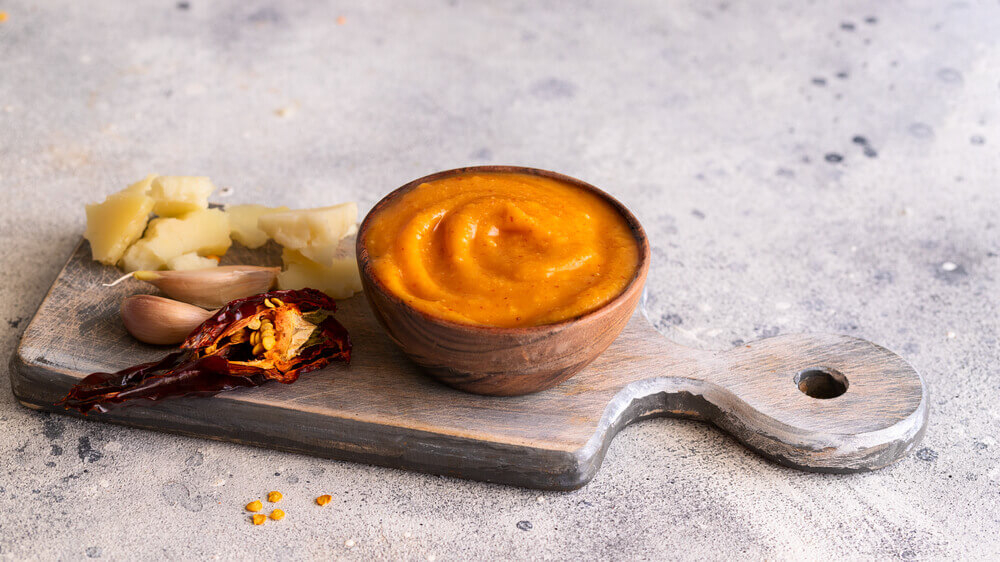 Canary Island food: A small bowl of almogrote cheese with cheese, garlic and chilli on the side