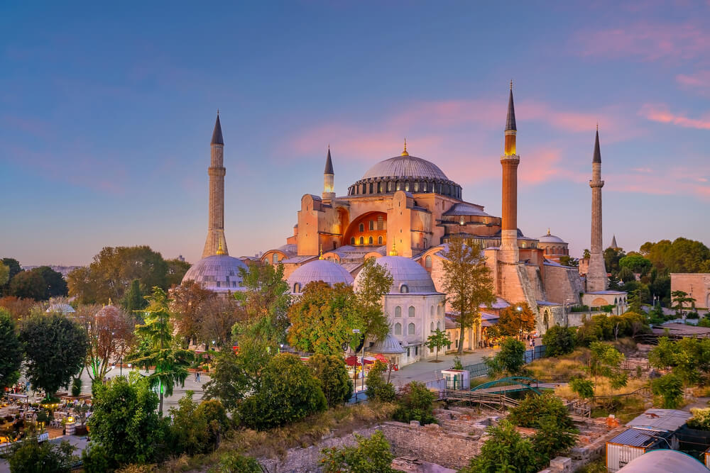 Cyber Monday travel deals: a mosque surrounded by trees at dusk