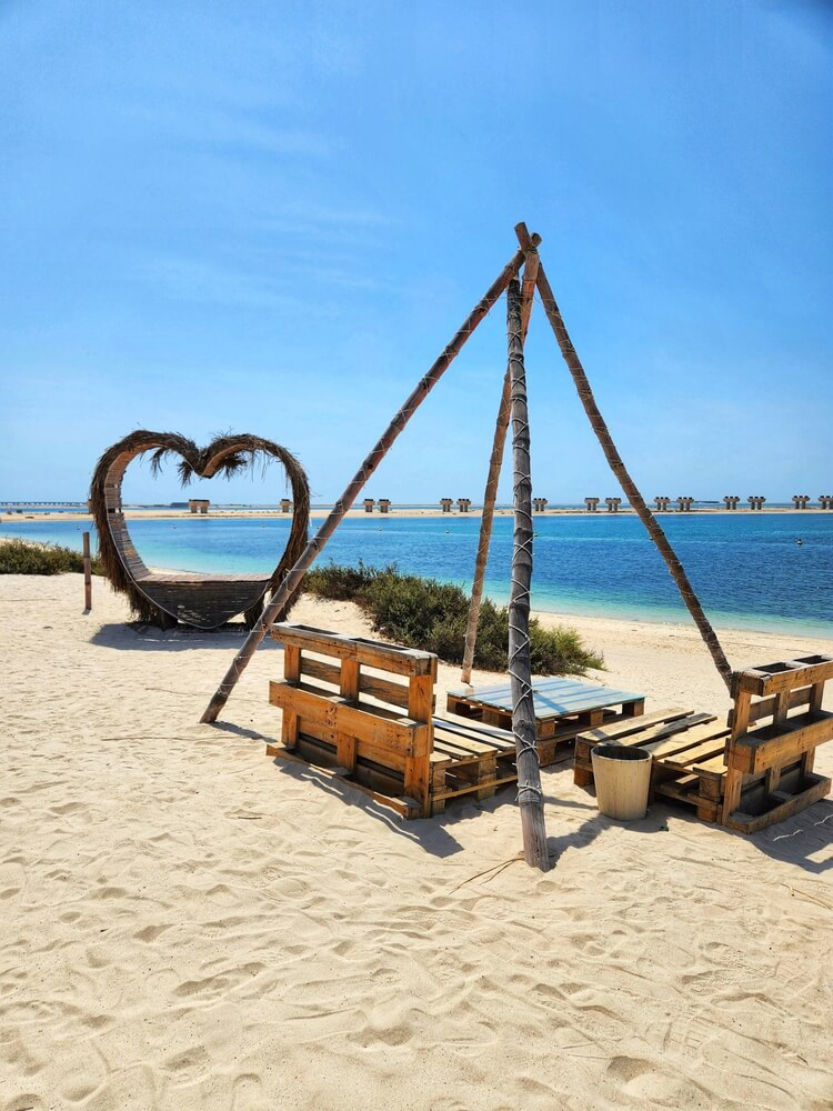 Dubai Beaches: Jebel Ali Beach with pallet seats, a wigwam and heart shaped booth