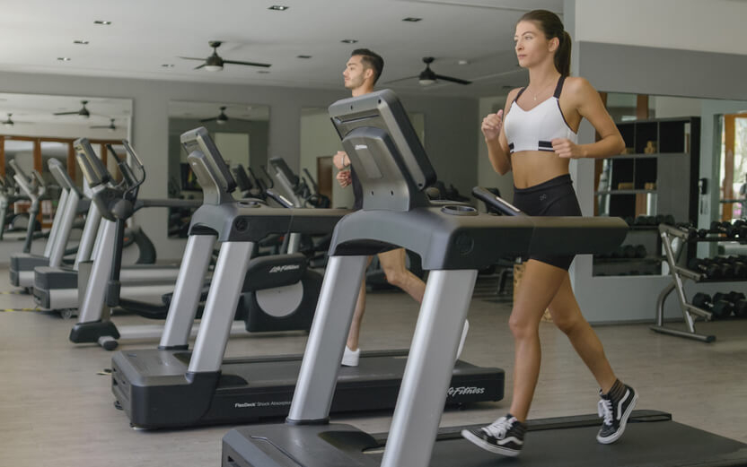 A woman working out on vacation in a hotel gym