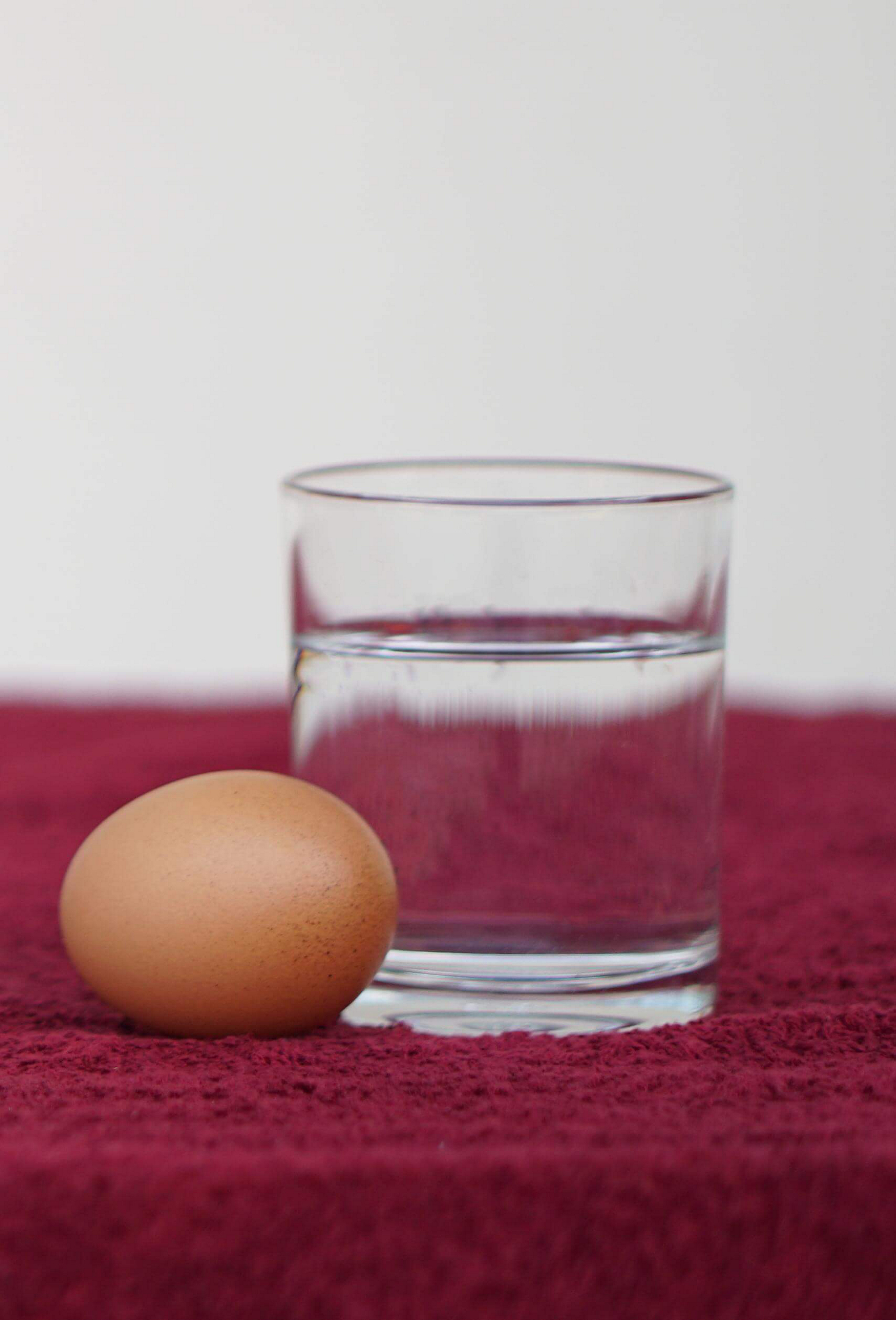 Egg and water: A glass of water with an egg next to it for El Salvador’s New Year’s