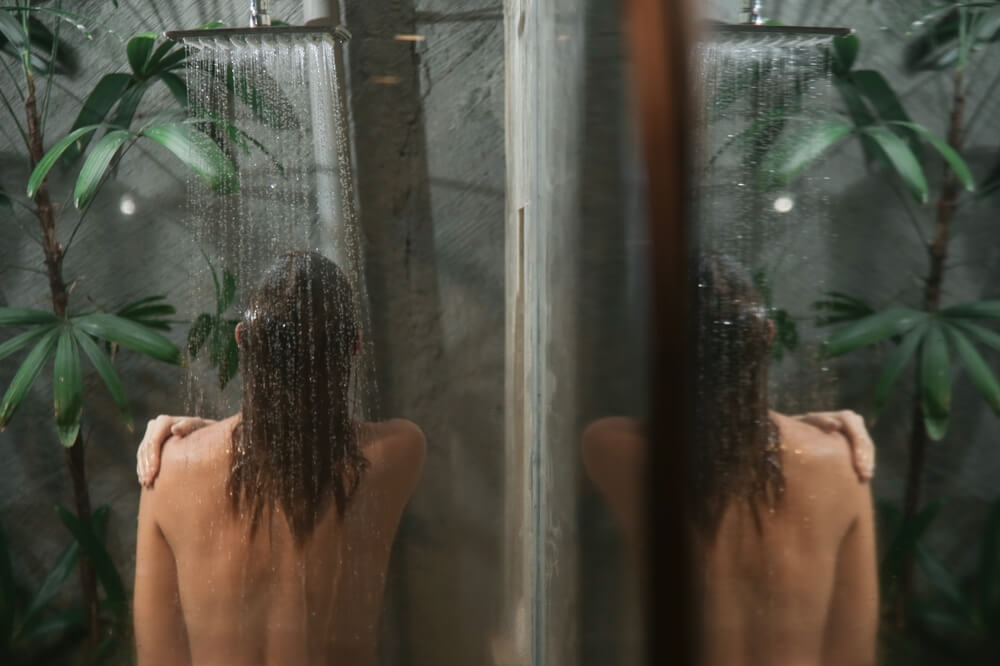 Hotel showers: Girl washing in a hotel shower