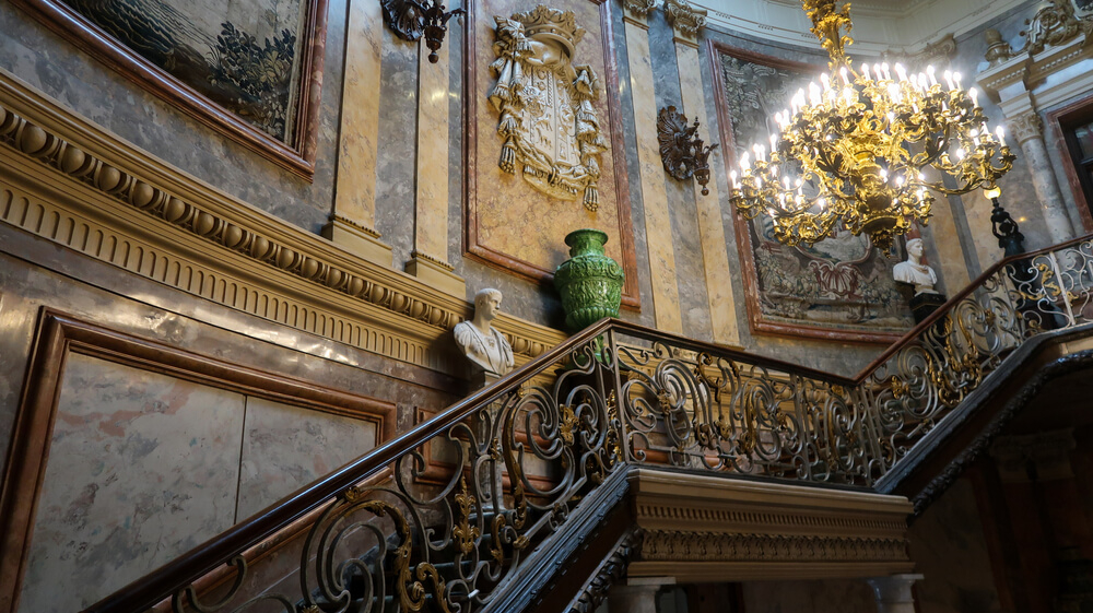 Cerralbo Museum: Ornate marble staircase, golden chandeliers and alabaster busts inside the museum