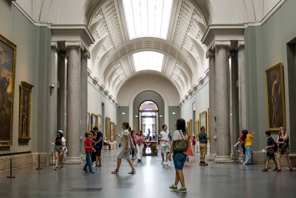 Museums in Madrid: Inside the Prado Museum art gallery’s white halls full of people