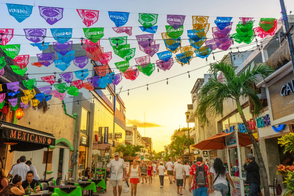 5th Avenue: People walking down the main shopping street in Playa del Carmen