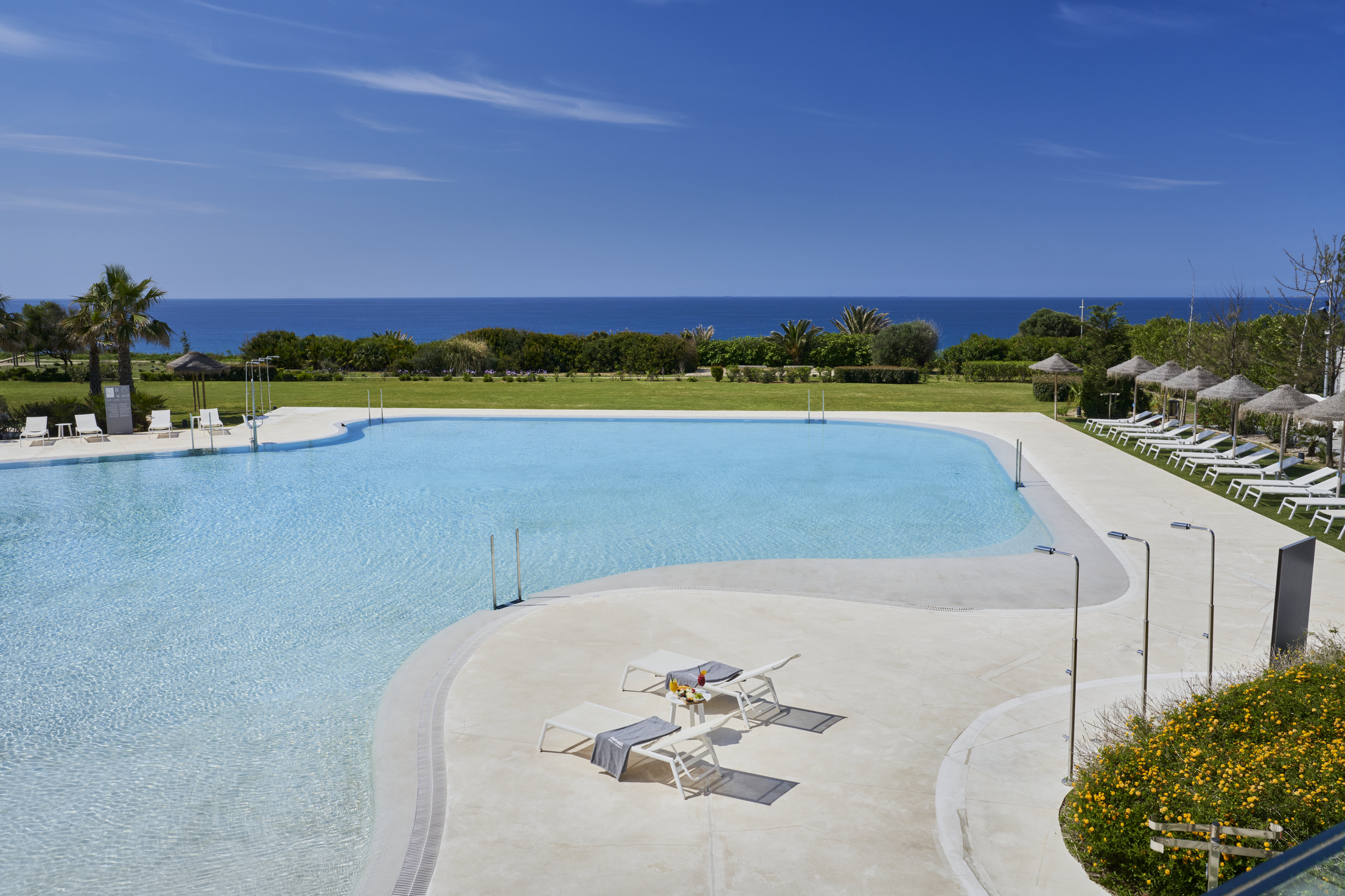 Barceló Conil: A view of one of the outdoor swimming pools at the Barceló Conil Playa hotel