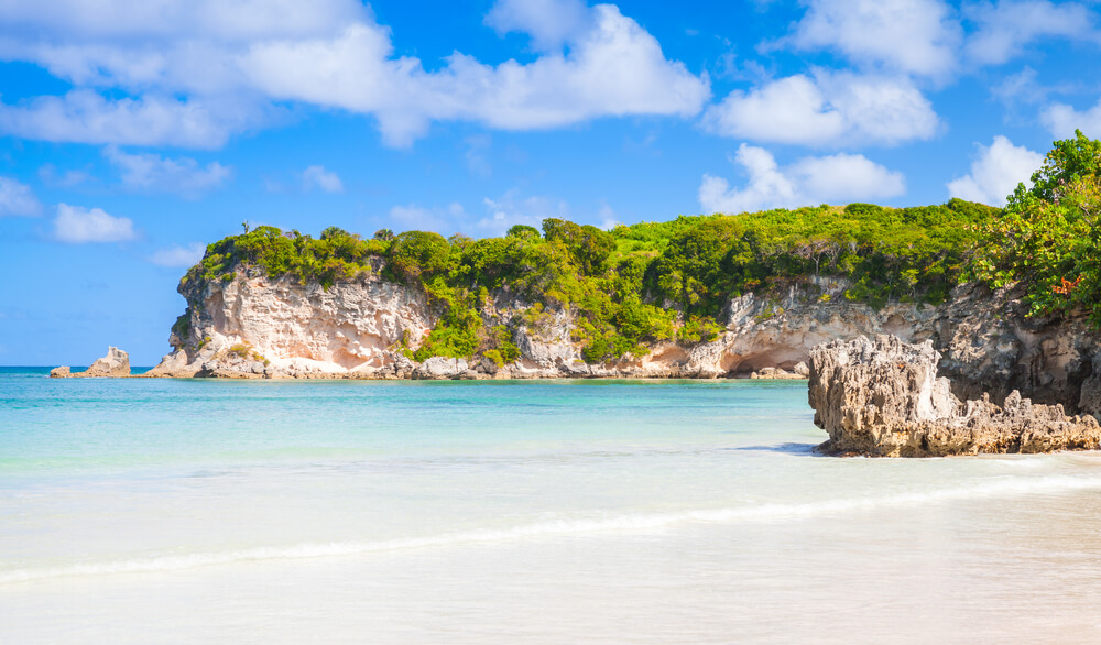 Macao Beach with green cliffs