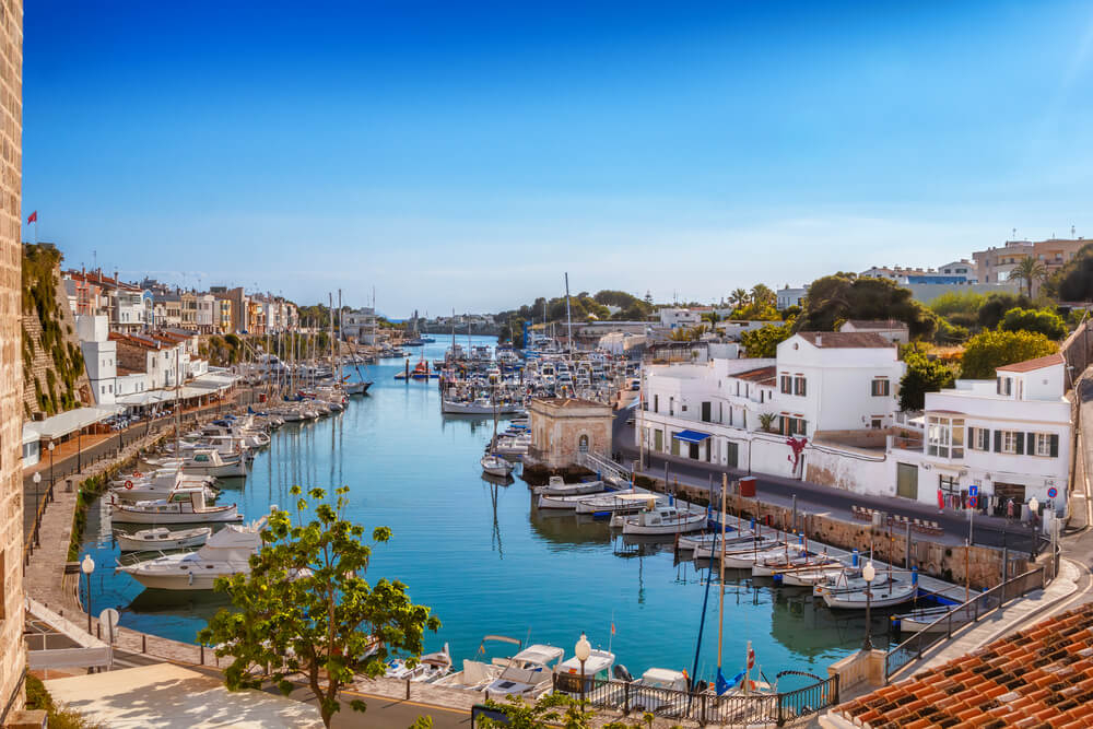 Ciutadella Menorca: A typical Mediterranean harbour with sailing boats and houses