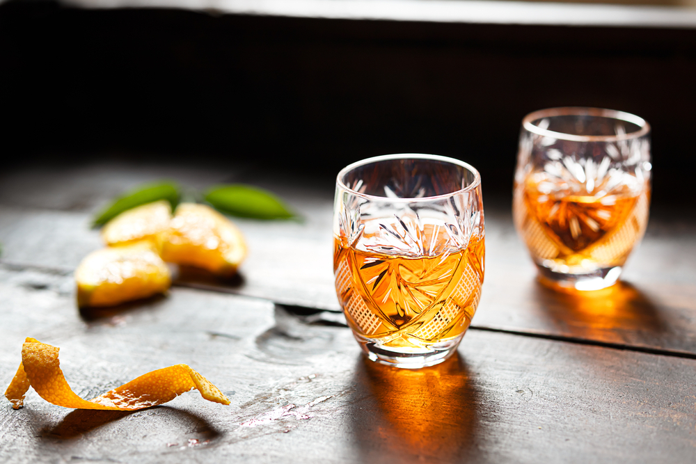 Souvenirs from Mallorca: Two glasses of Angel d’Or liqueur on a table with an orange twist