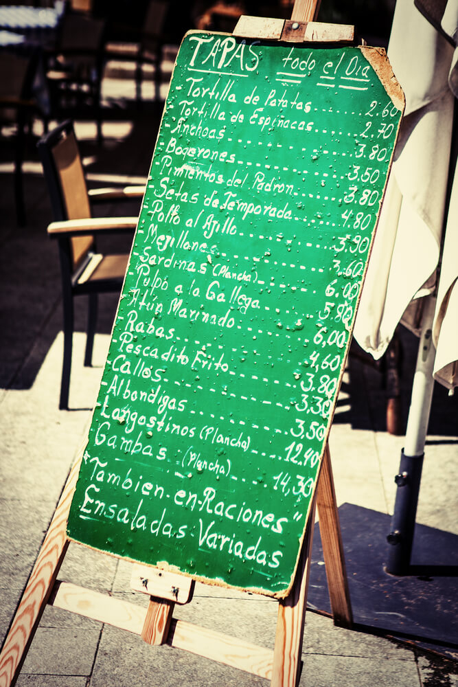 Madrid tapas bar: A red facade of a traditional tapas bar in Madrid, Spain