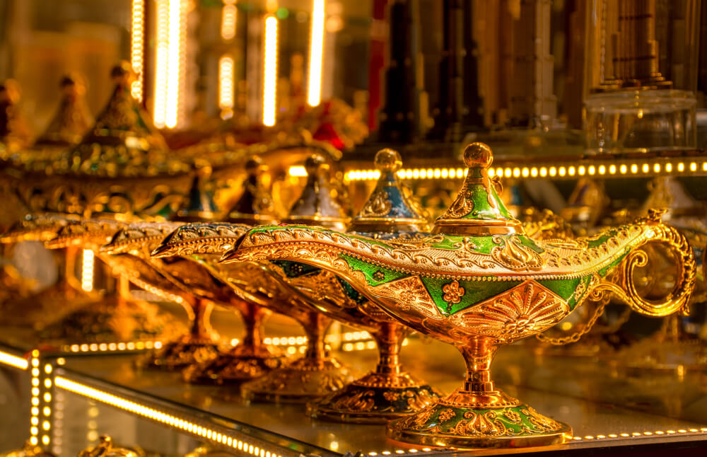 Dubai Gold Souk: Golden hand-held lamps lined up on a table