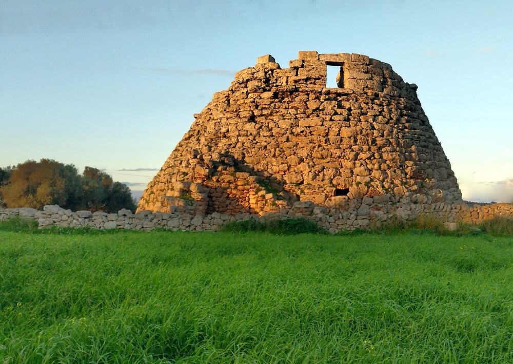 A stone megalith on a grassy stretch of land