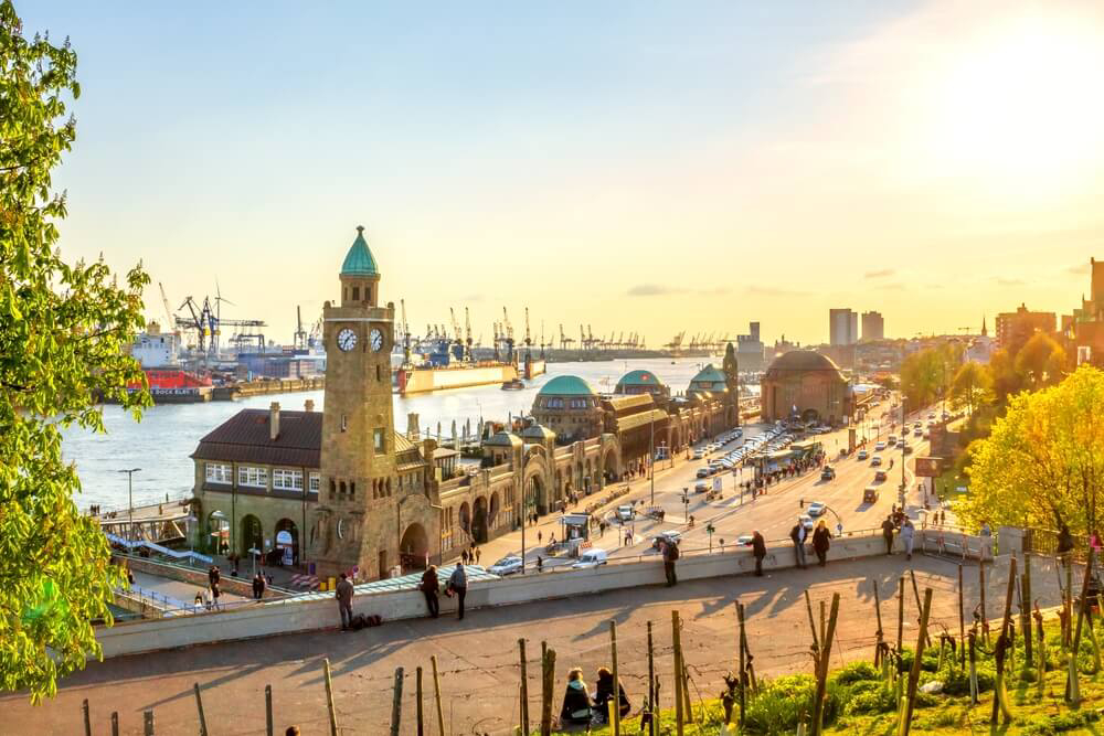 Things to do in Hamburg: The Hamburg port in the sunshine with a municipal building in view