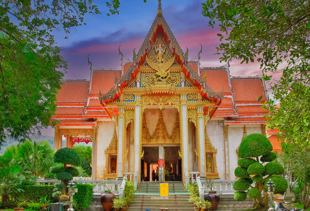 Places to visit in Phuket with family: the outside of Wat Chalong Temple at sunset