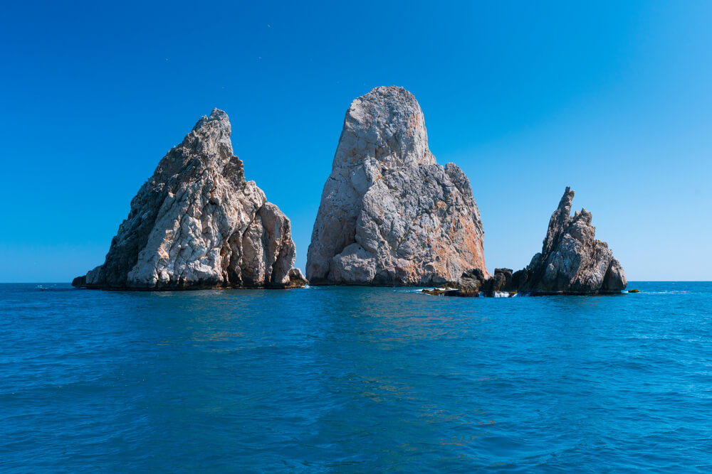 Medas Islands: Two grey rocks jutting out of the water surrounded by blue ocean