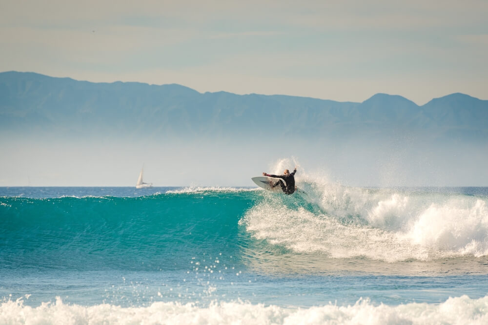 Water sports in Tenerife: Man surfing a large wave