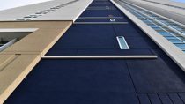 Street side (west elevation) of the contemporary urban beach-inspired design which is clad with over 100,000 sq ft of BASF Senergy Channeled Adhesive Design EIFS.