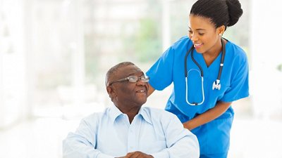 Arboviral Diseases Photo of a nurse pushing an elderly man in a wheelchair