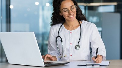 Sepsis Female doctor watching her computer and taking notes