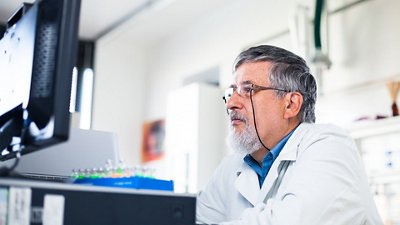 Syndromic testing A doctor watching his computer in his laboratory