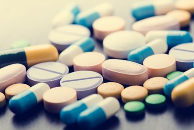 Pharmacy background on a black table. Tablets on a black background. Pills. Medicine and healthy. Close up of capsules. Differend kind of pills, Pharmacy background on a black table. Tablets on a black backgro