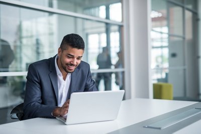 African american businessman working on a laptop.