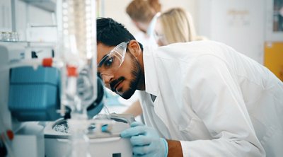 Young students of chemistry working together in laboratory