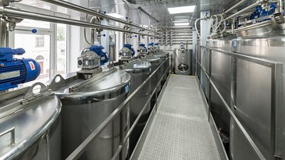 A lot of stainless steel tanks, modern production of spirits.