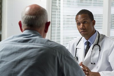African American doctor with older patient, horizontal