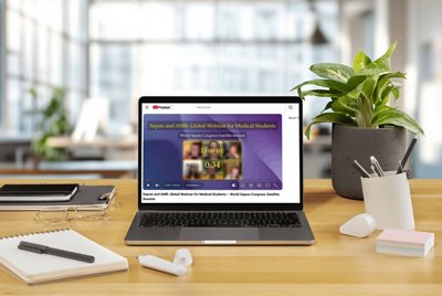 Visual of a laptop showing a BioMérieux webinar focused on sepsis and antimicrobial resistance (AMR) for medical students. The screen highlights a global webinar session linked to the World Sepsis Congress, presented in a modern workspace environment.