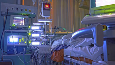 Glowing monitors in intensive care department. Nigth shift at icu, patient in critical state.