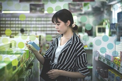 A young Asian woman is choosing medicine