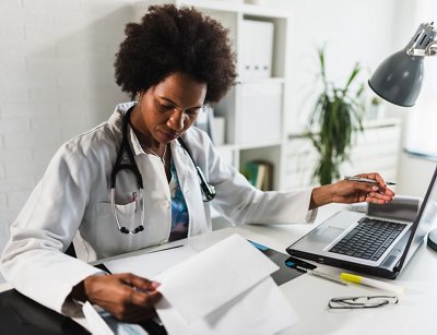 Woman doctor with stethoscope looking at medical papers at her office working hard, Woman doctor with stethoscope looking at medical papers at her o