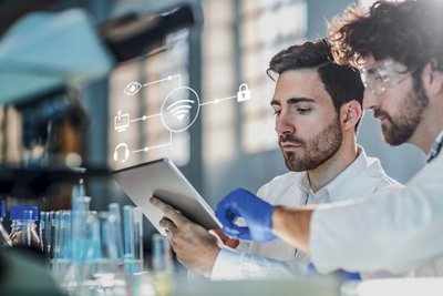 two scientist using digital tablet in laboratory